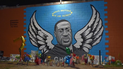 Lidé v amerických městech vytvářejí pietní místa.